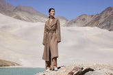 a woman in camel coat